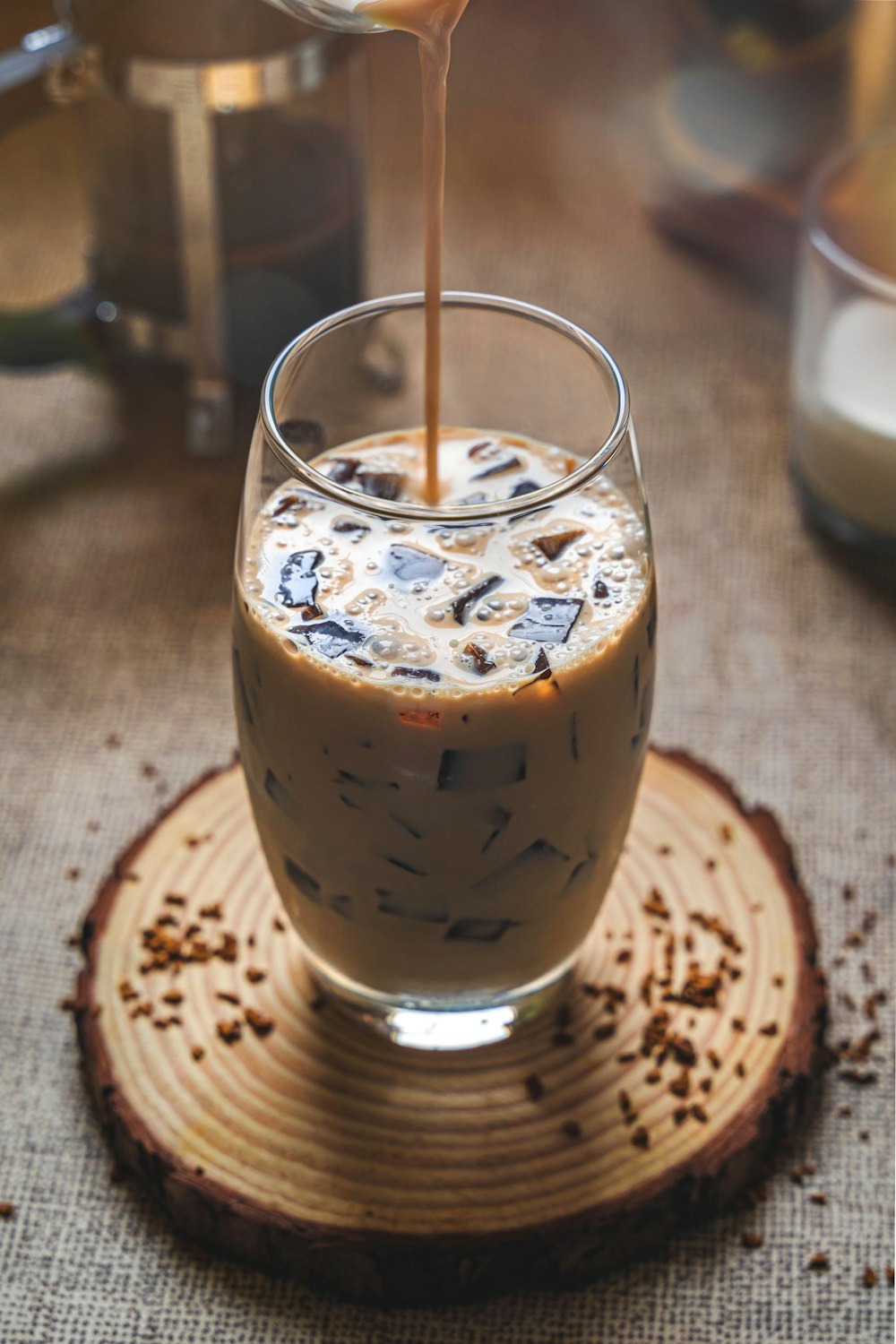 clear drinking glass with brown liquid