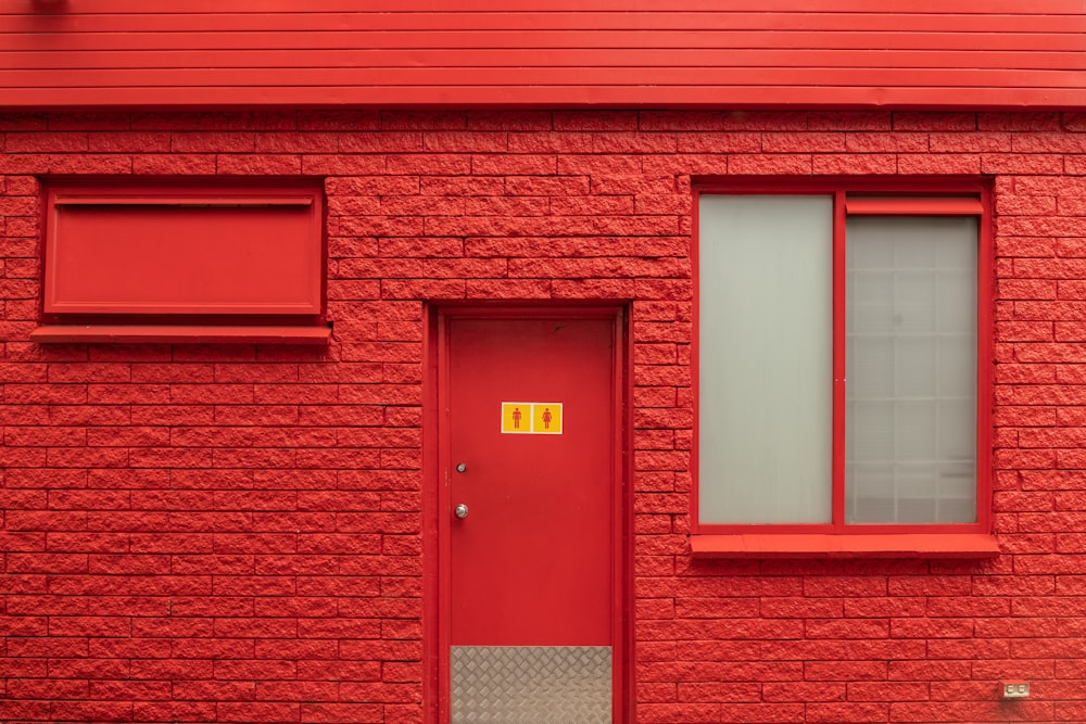 red brick wall with brown wooden door