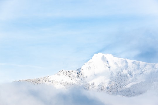 snow covered mountain under blue sky during daytime in Sankt Gilgen Austria