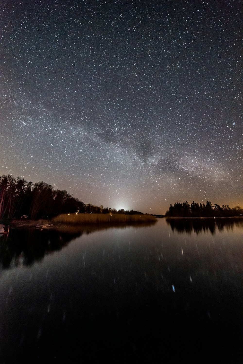 body of water under starry night