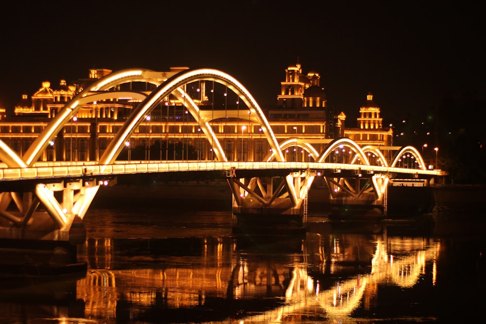 white bridge over river during night time