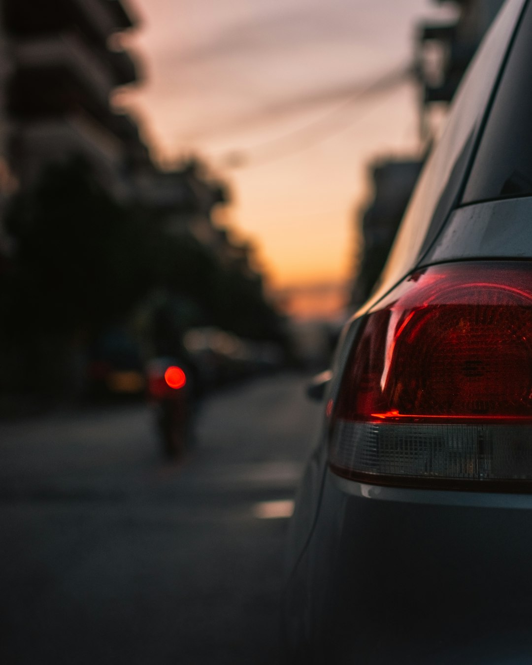 red car on road during daytime