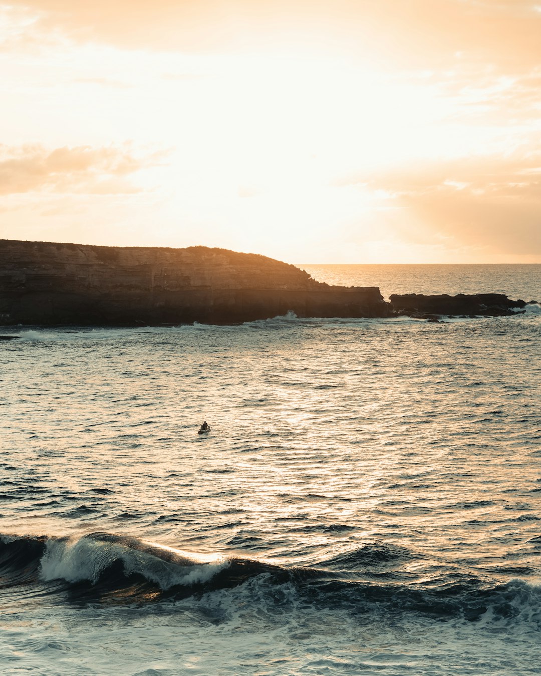 brown rock formation on sea during daytime