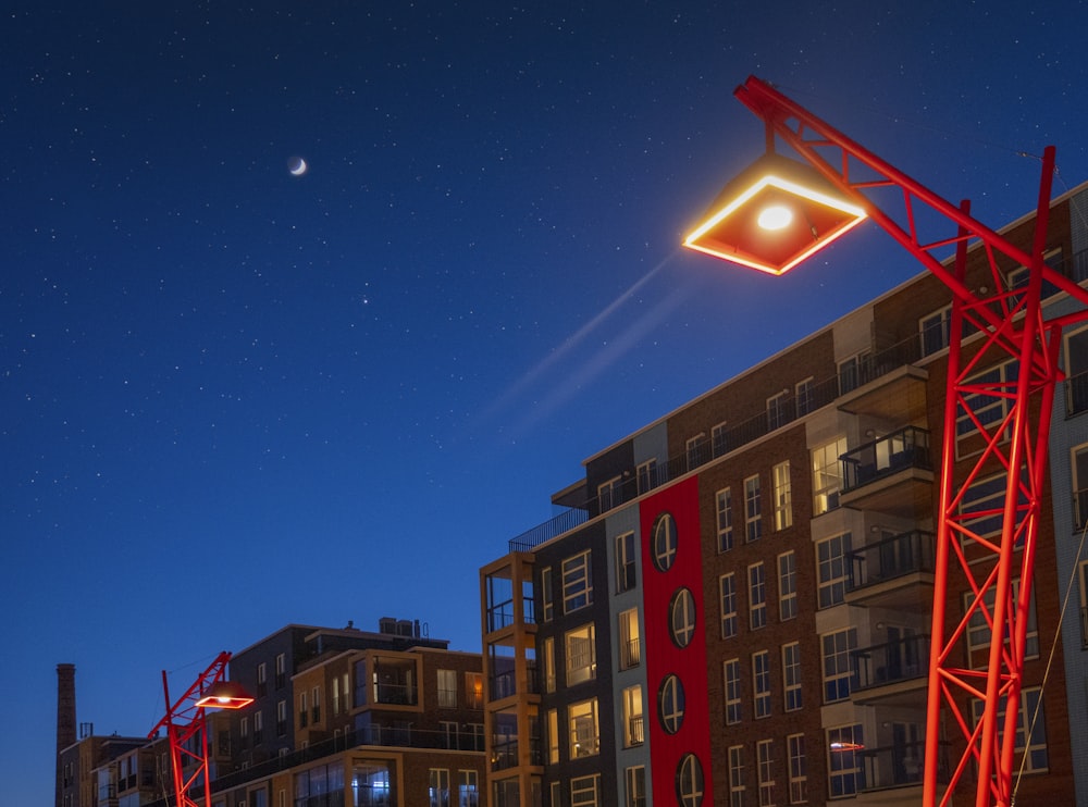 red and white concrete building under blue sky during nighttime