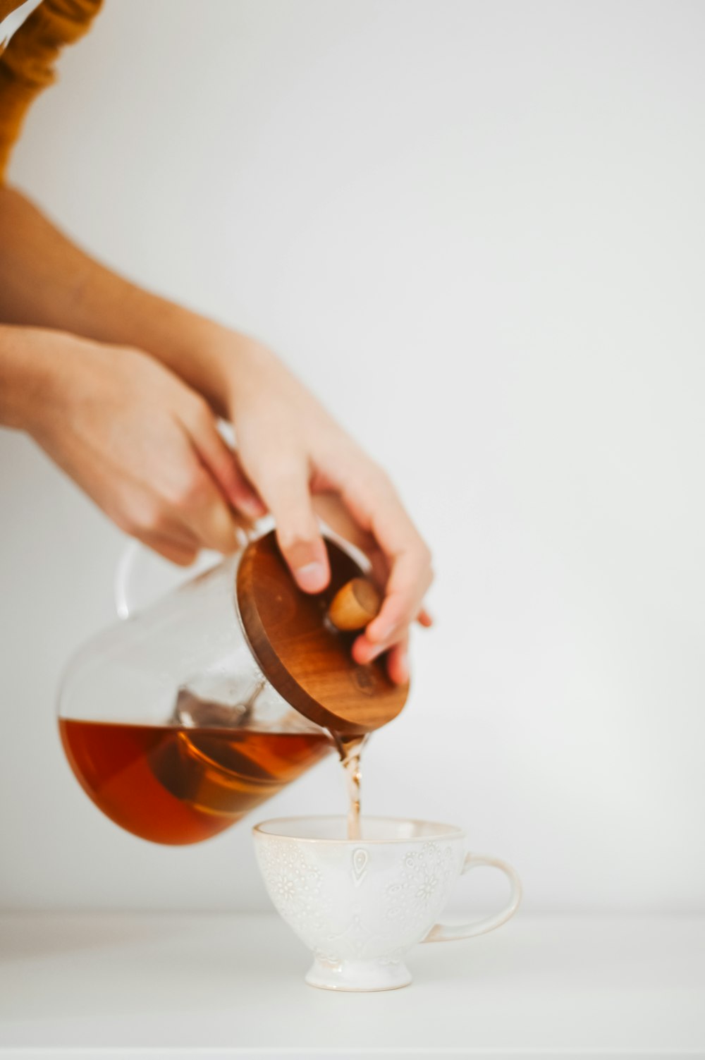 person holding clear wine glass