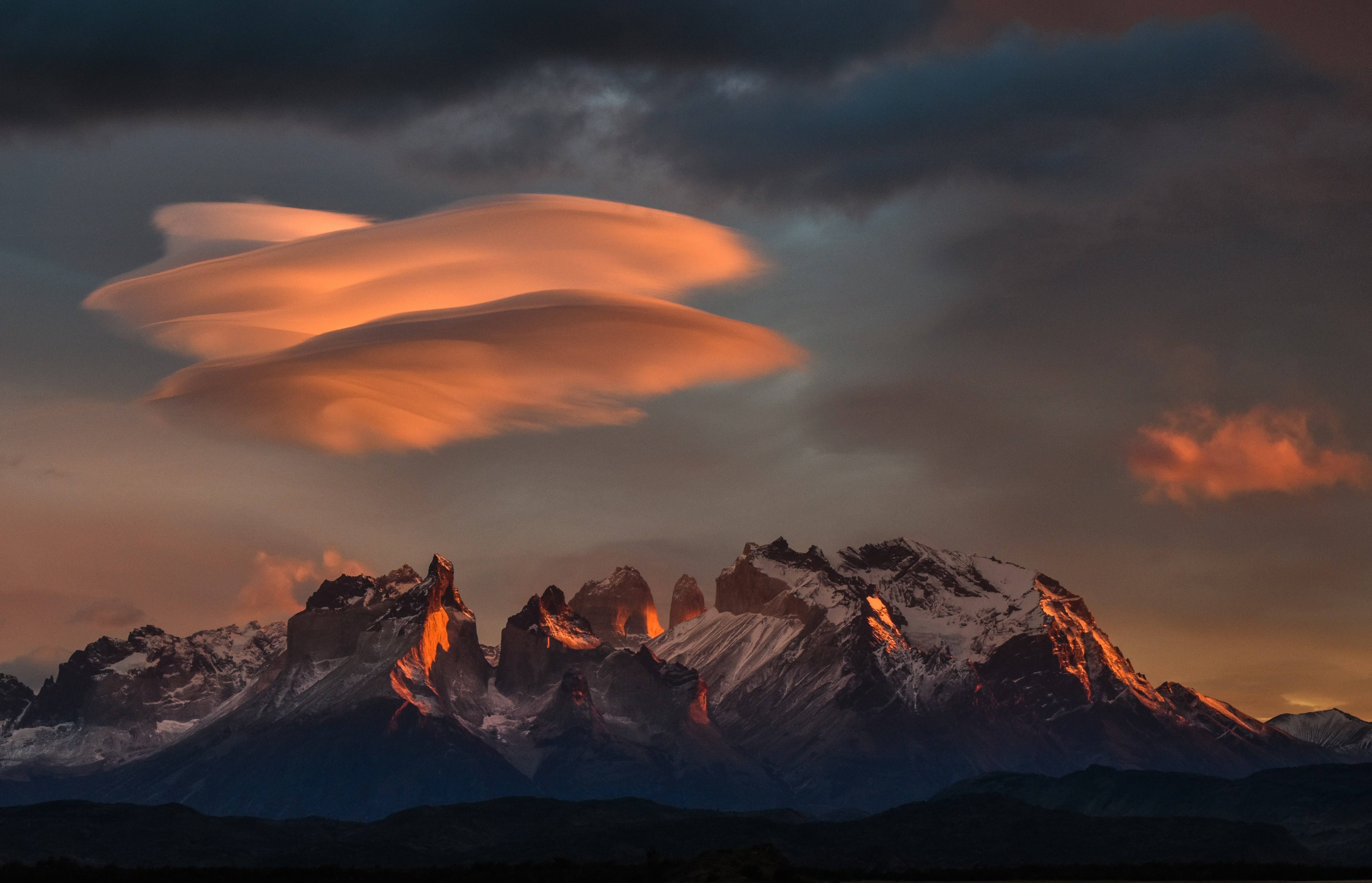 rocky mountain under orange sky, Lenticular sunrise - Torres del Paine, Chile - 08:38 am