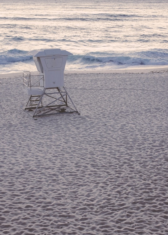 white and gray lifeguard chair on beach shore during daytime in Bondi Beach NSW Australia