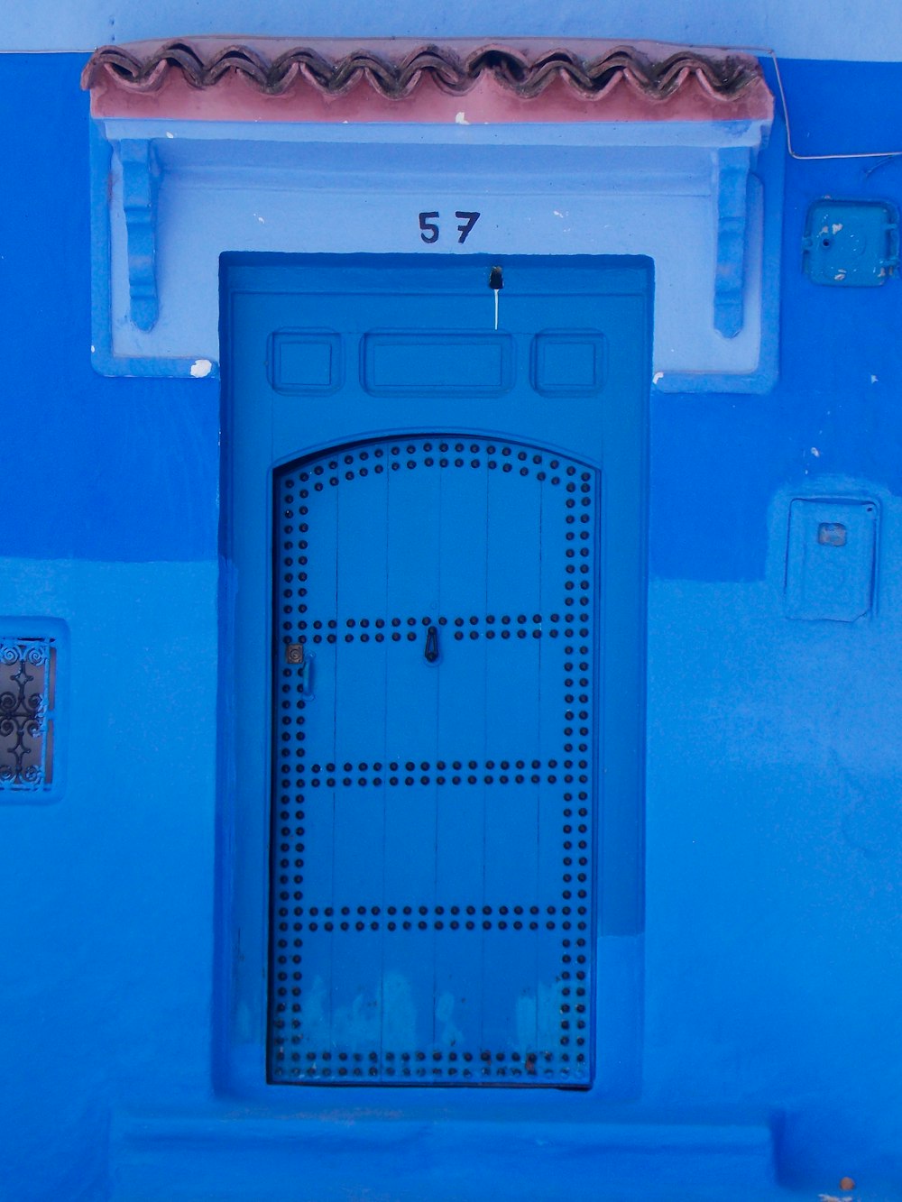 blue wooden door with blue steel door lever