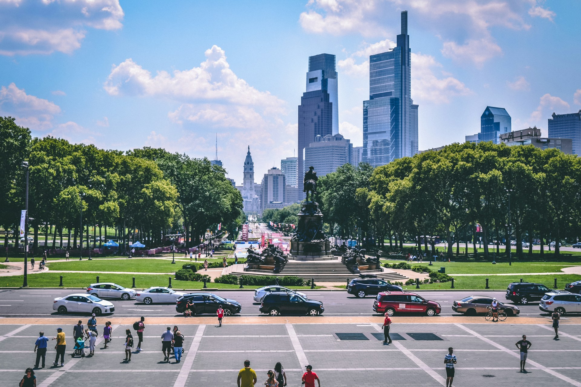 people walking on street near high rise buildings during daytime
