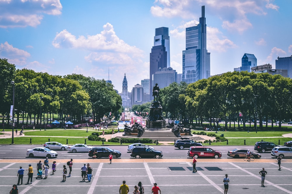 people walking on street near high rise buildings during daytime