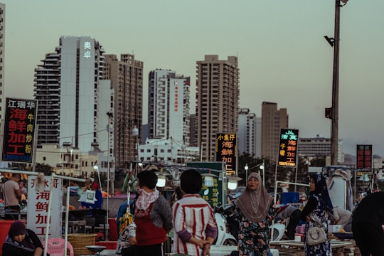 people walking on street during daytime in Sanya China