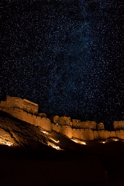 brown concrete building under starry night