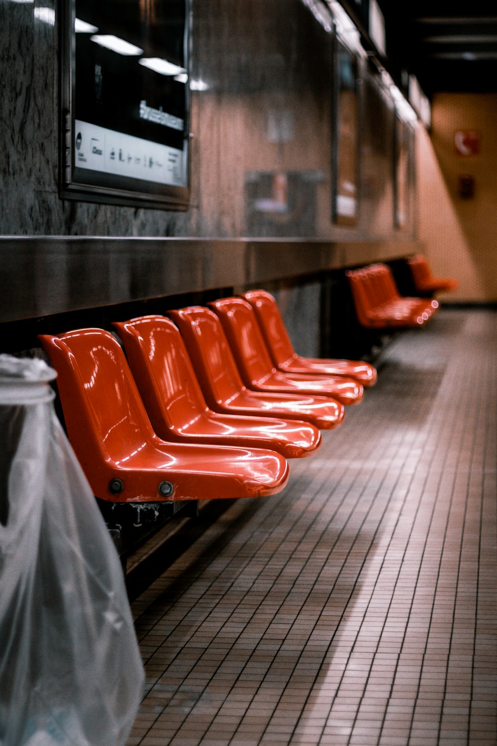 red plastic chairs on black floor