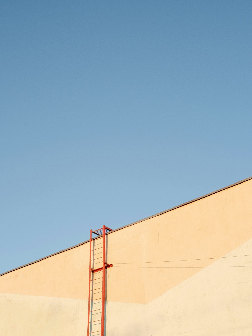 beige concrete building under blue sky during daytime