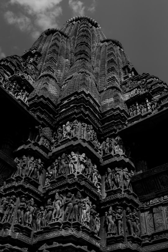 grayscale photo of concrete building in Khajuraho India