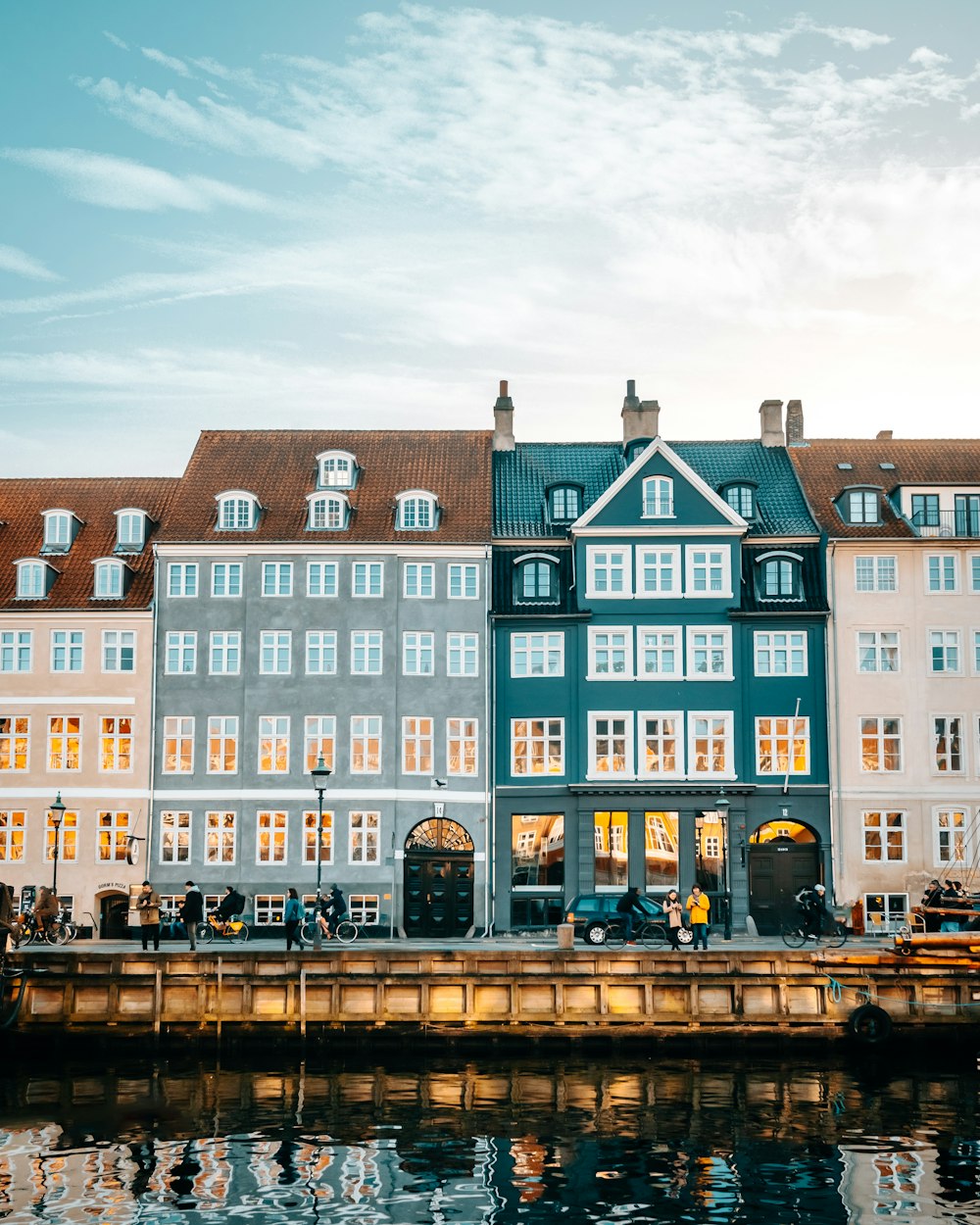 a row of buildings next to a body of water