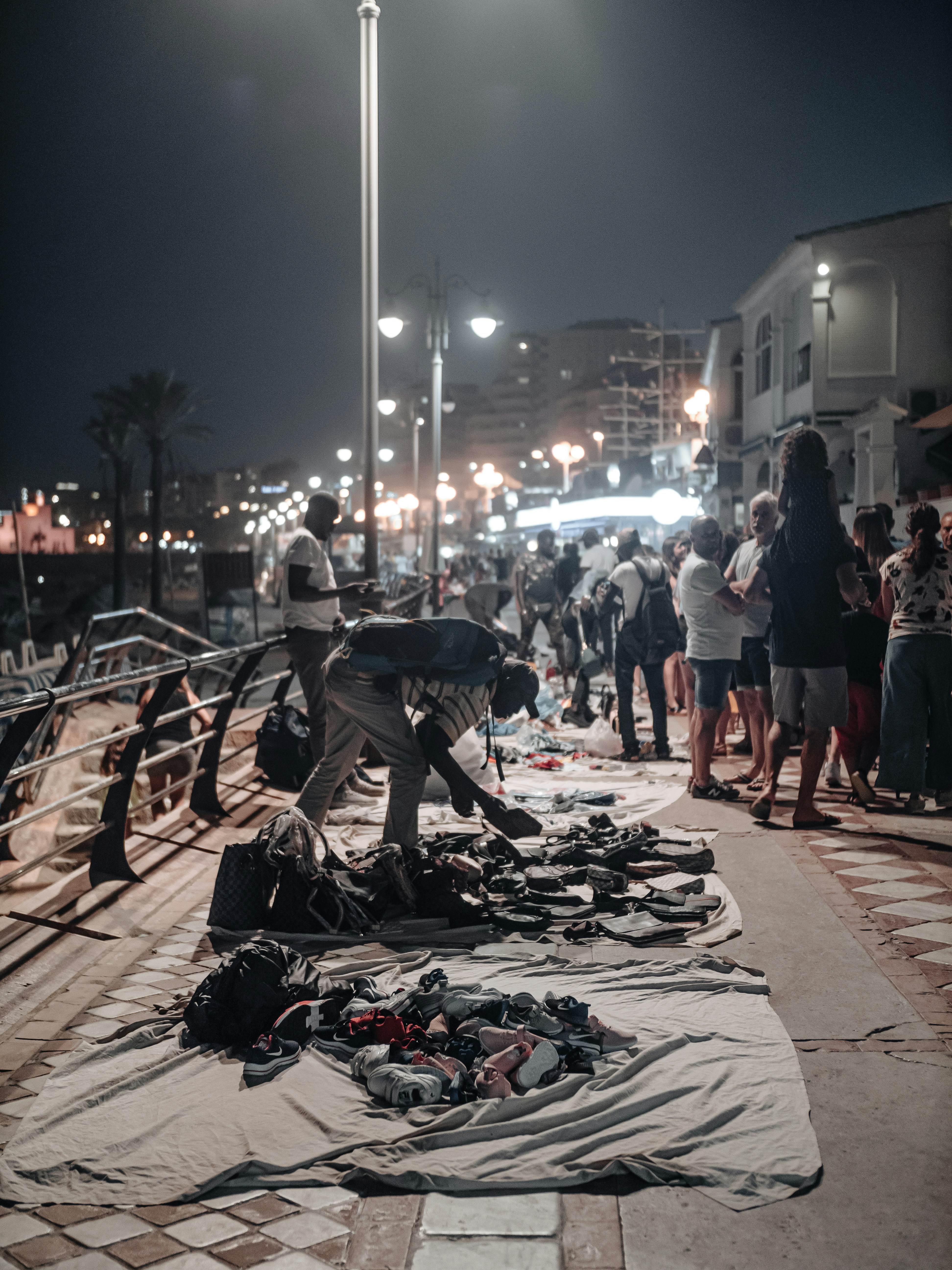 people walking on street during night time