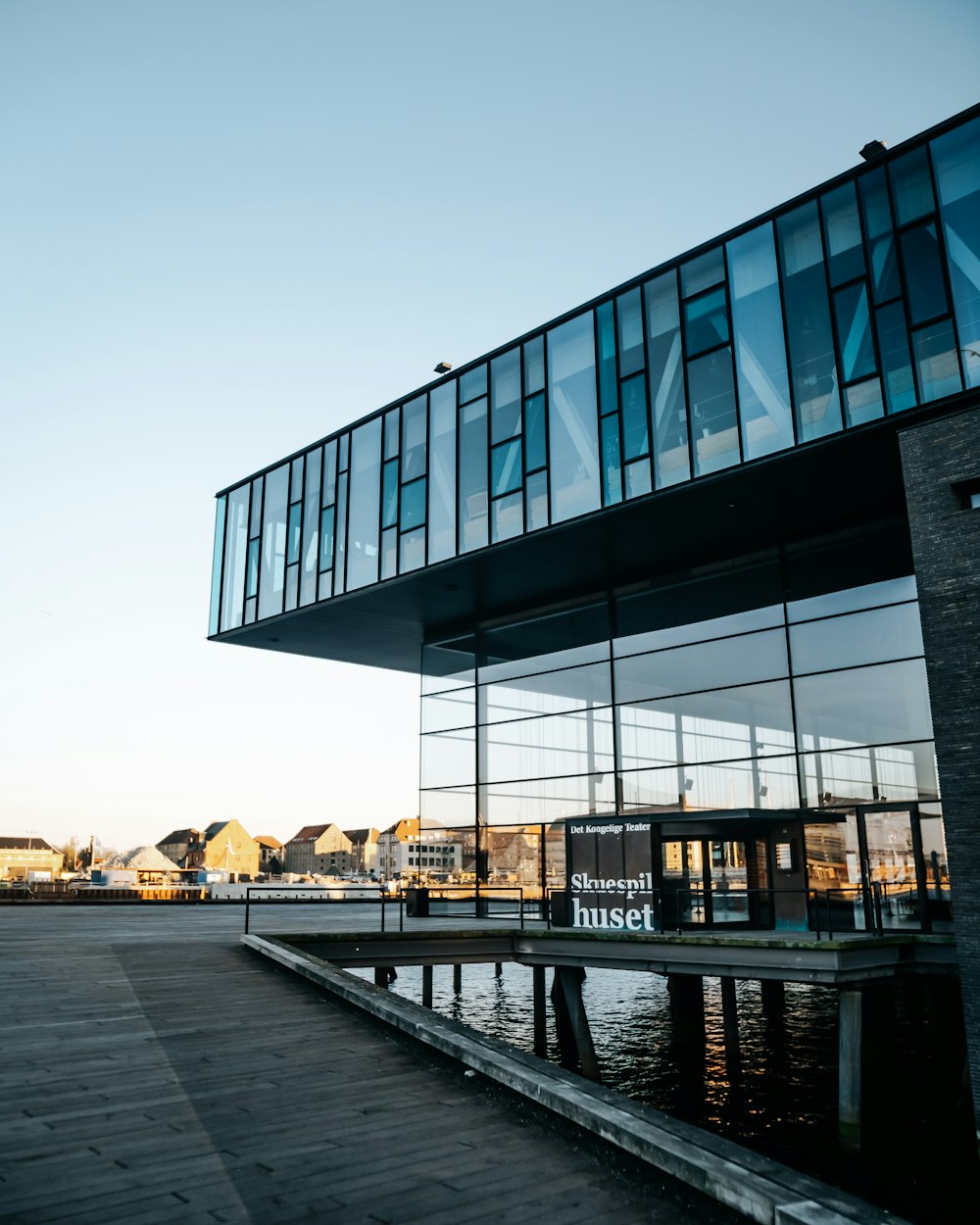 gray concrete building near body of water during daytime