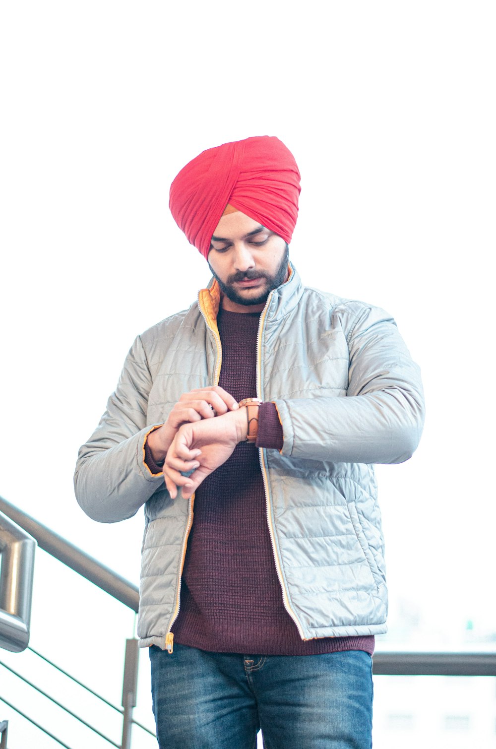 man in white dress shirt and red knit cap