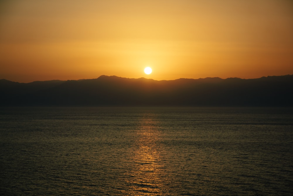 silhouette of mountain during sunset