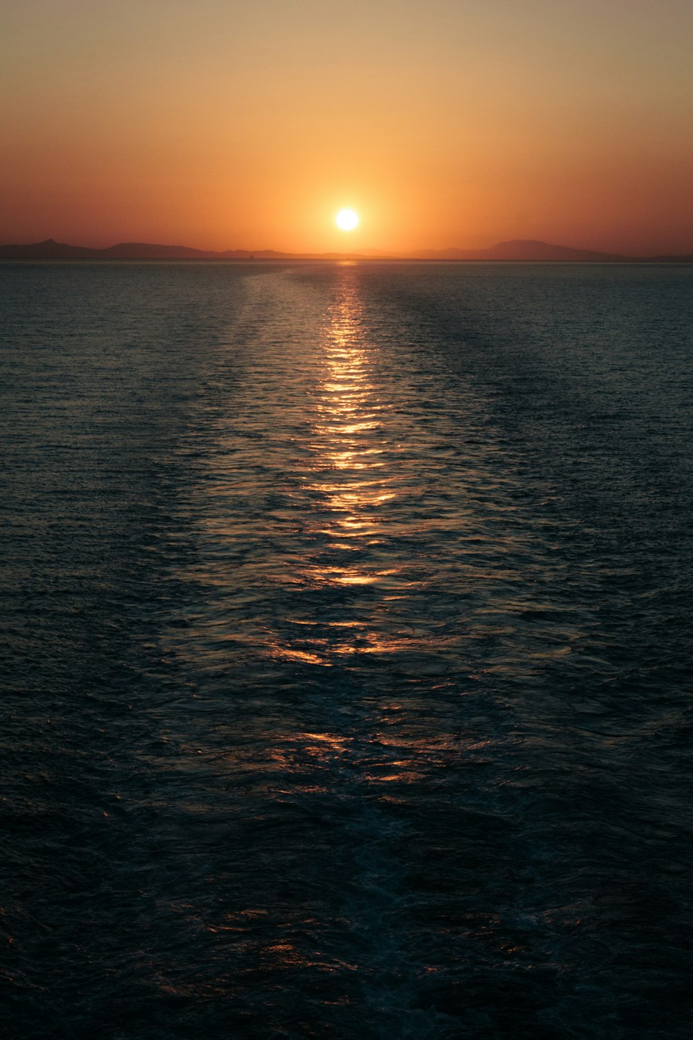 body of water during sunset