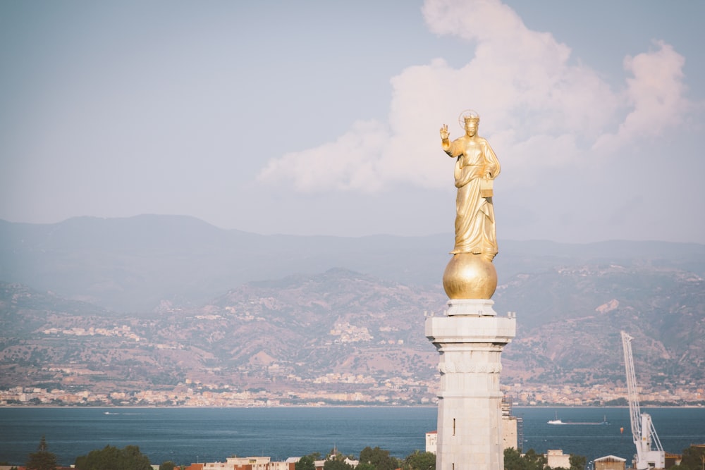 gold statue of a man