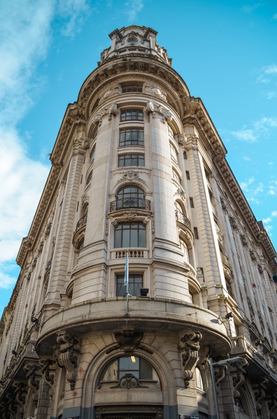 brown concrete building under blue sky during daytime in Plaza de Mayo Argentina