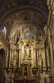 A close-up of the intricately carved wooden altar inside the church.