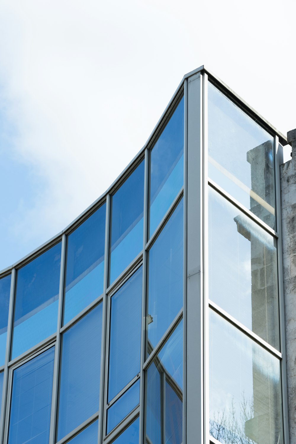 blue and white glass walled building