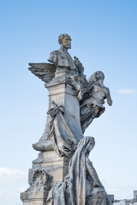 angouleme remparts angel statue under blue sky during daytime