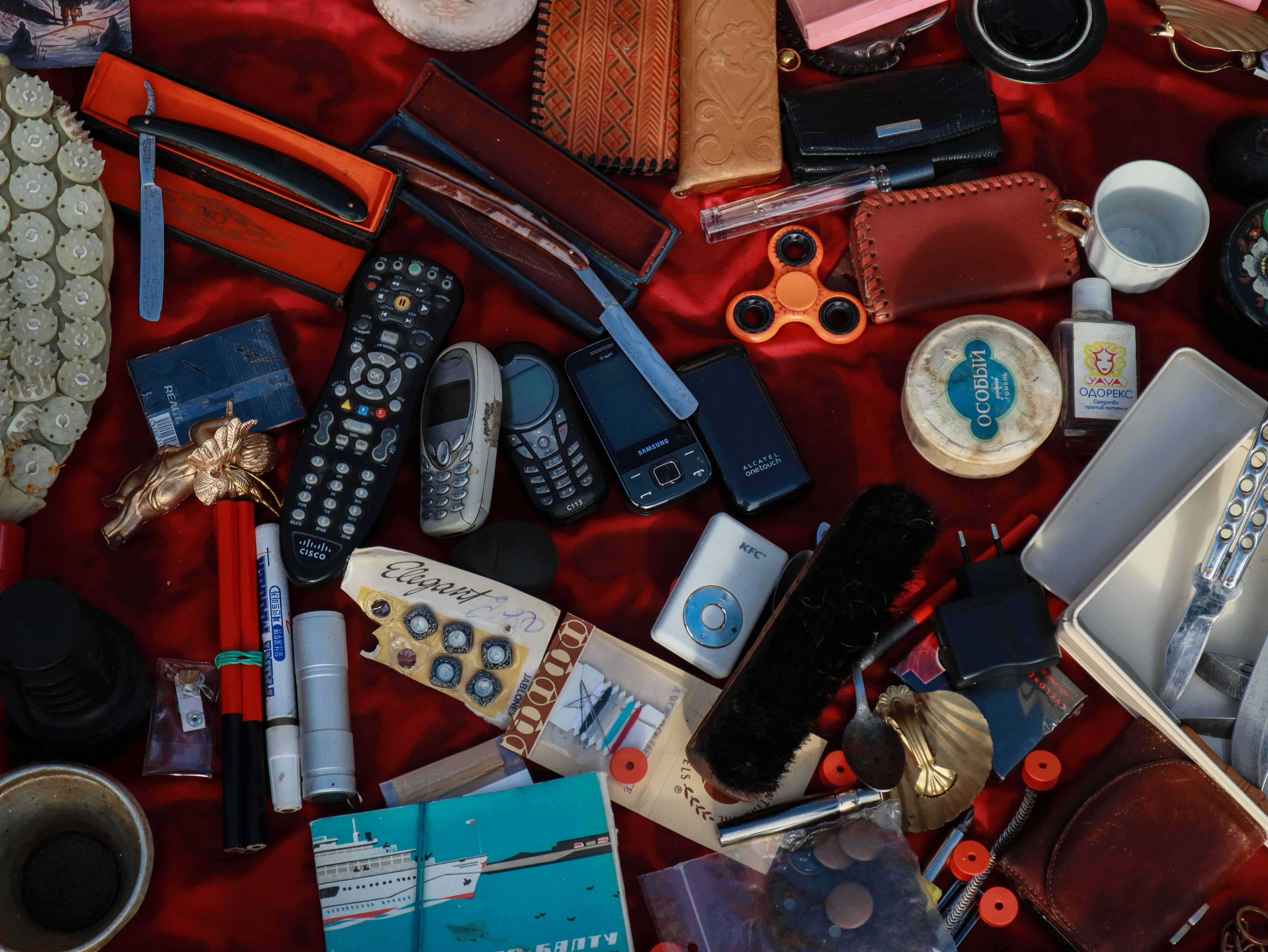 black remote control beside black smartphone