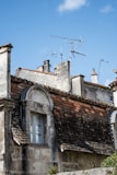 brown brick building under blue sky during daytime