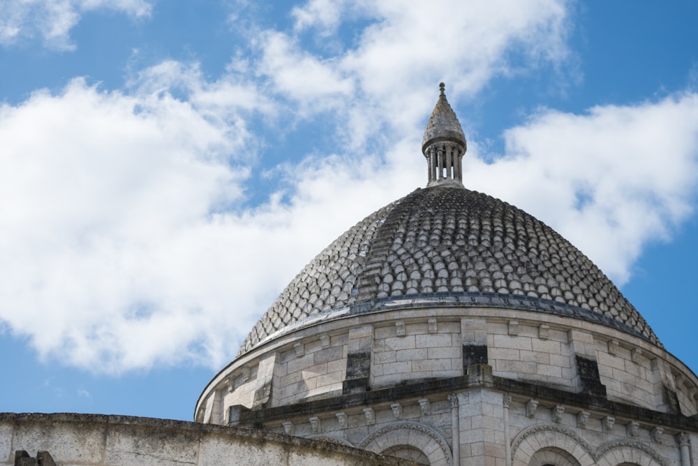 gray concrete dome building under blue sky during daytime