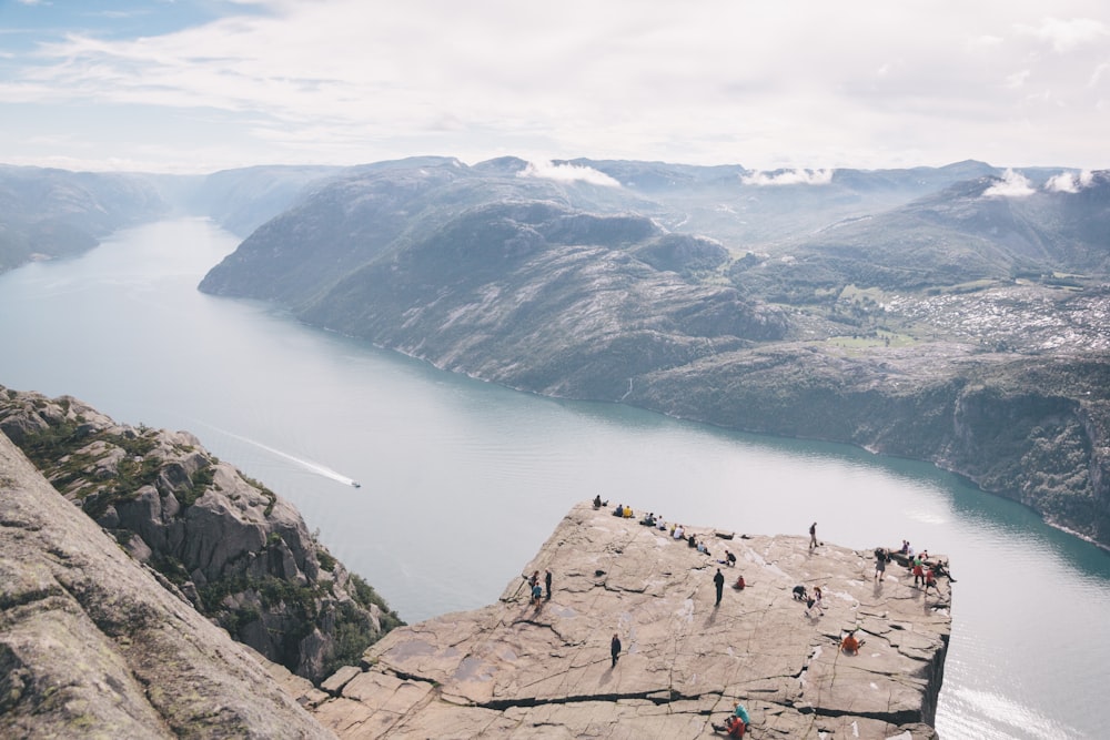 people standing on rocky mountain during daytime