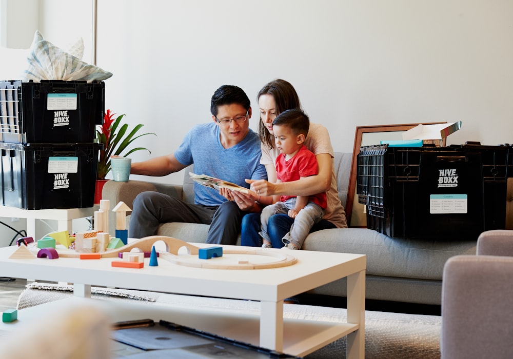 man and woman sitting on couch