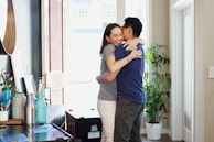 A hospice nurse warmly greeting a family in their living room, illustrating the heart of home care.