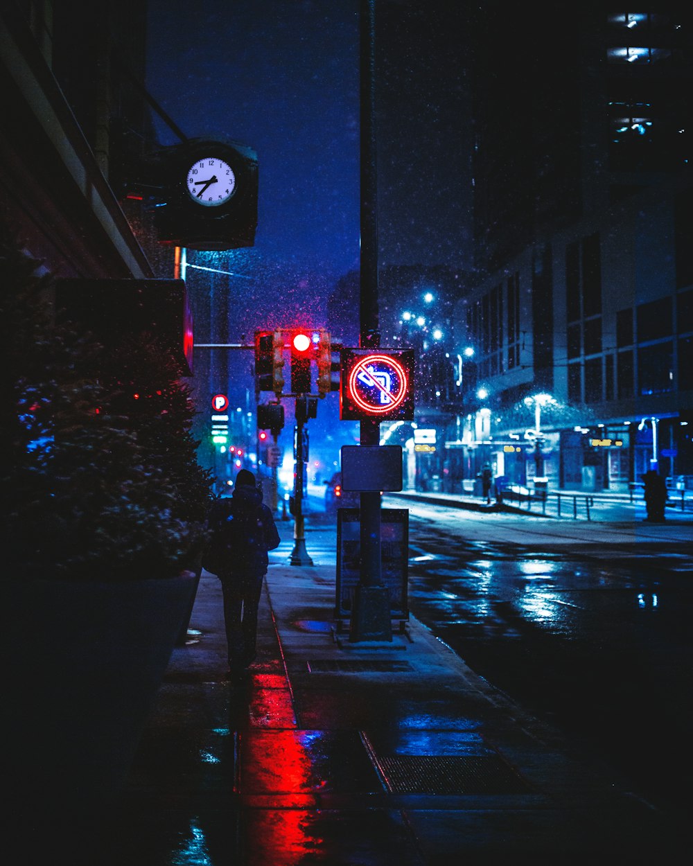 red and white traffic light on the street during night time