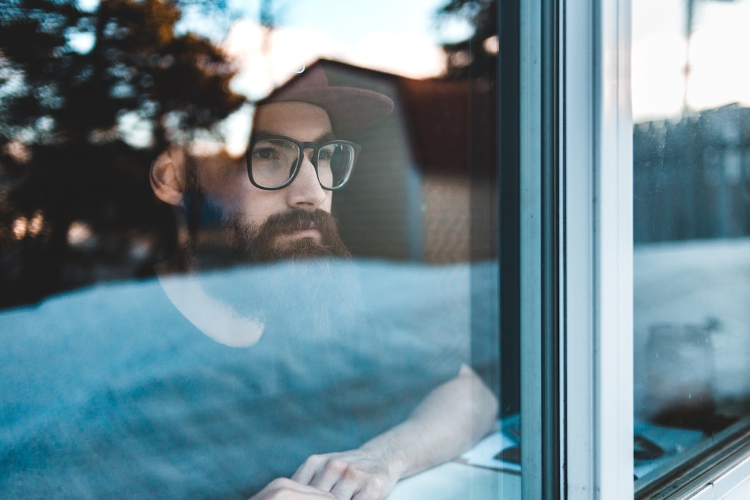 man in black framed eyeglasses