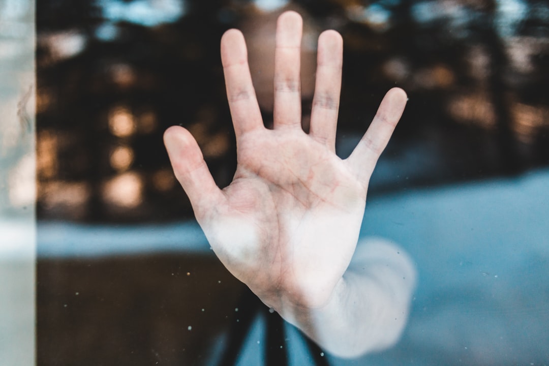 persons left hand with water droplets