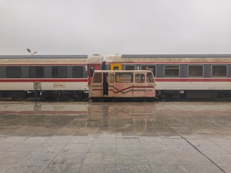 A TrustRide vehicle waiting patiently at a train station, ready for pickup.