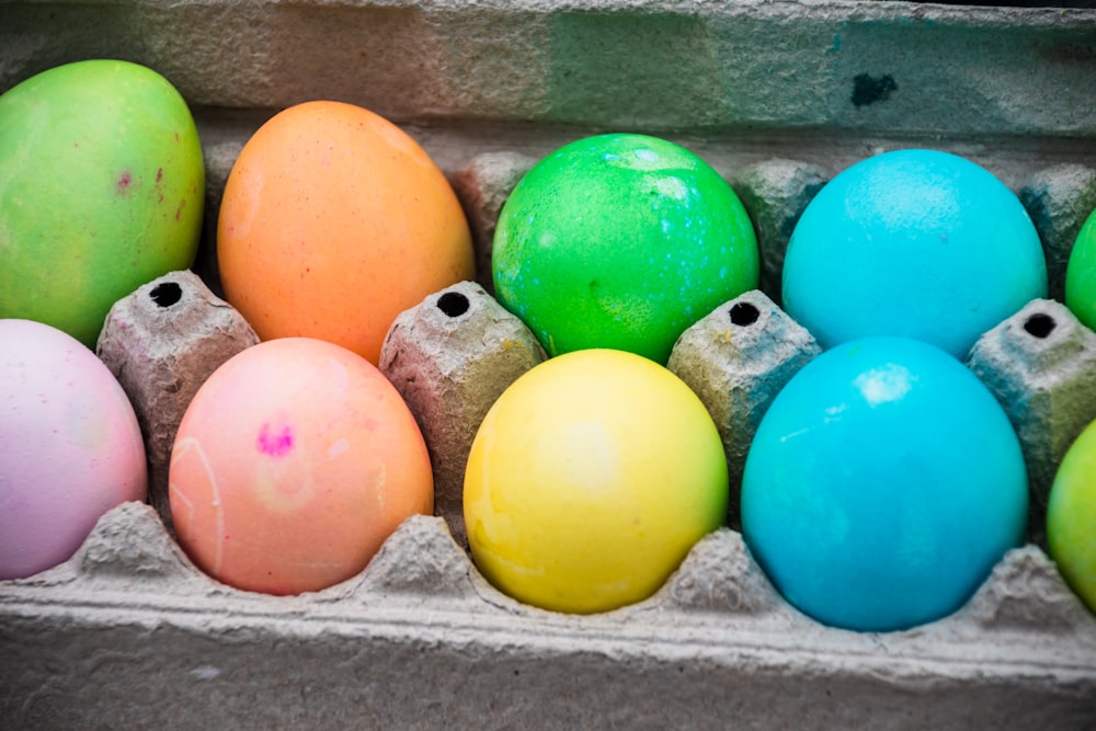 yellow blue and pink egg on tray