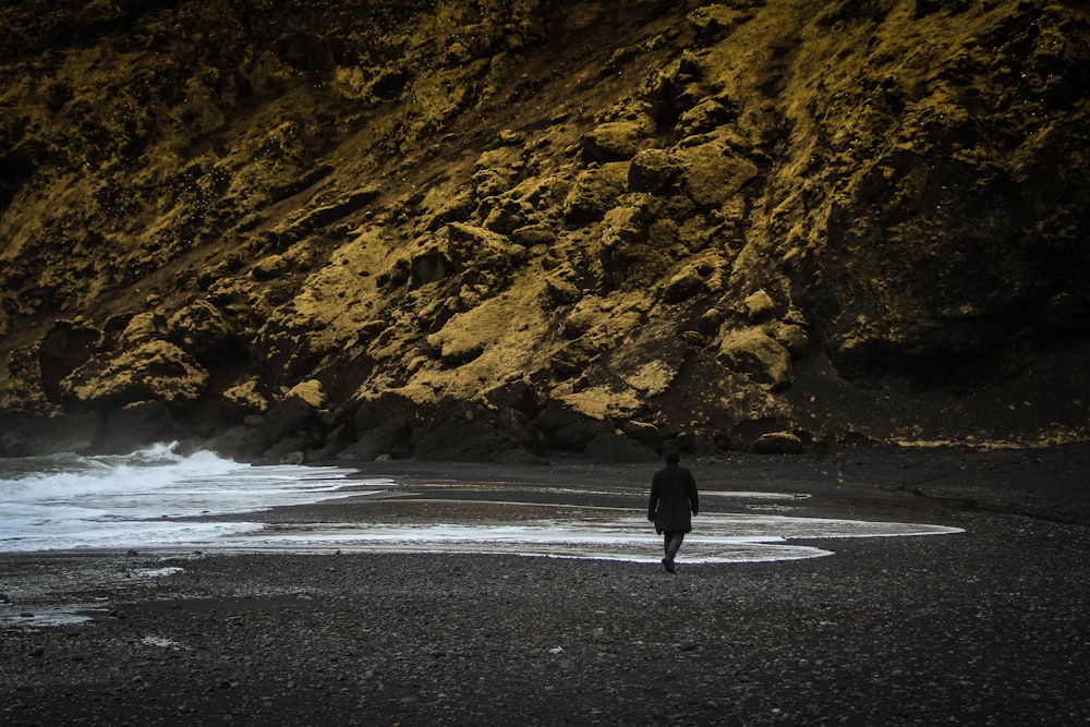 person walking on gray asphalt road during daytime