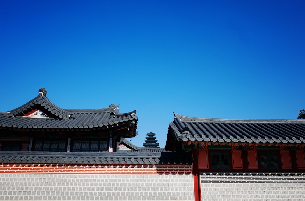 white and red concrete building under blue sky during daytime