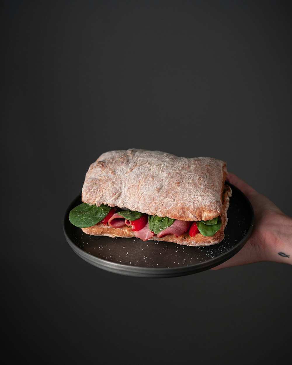 burger on black ceramic plate