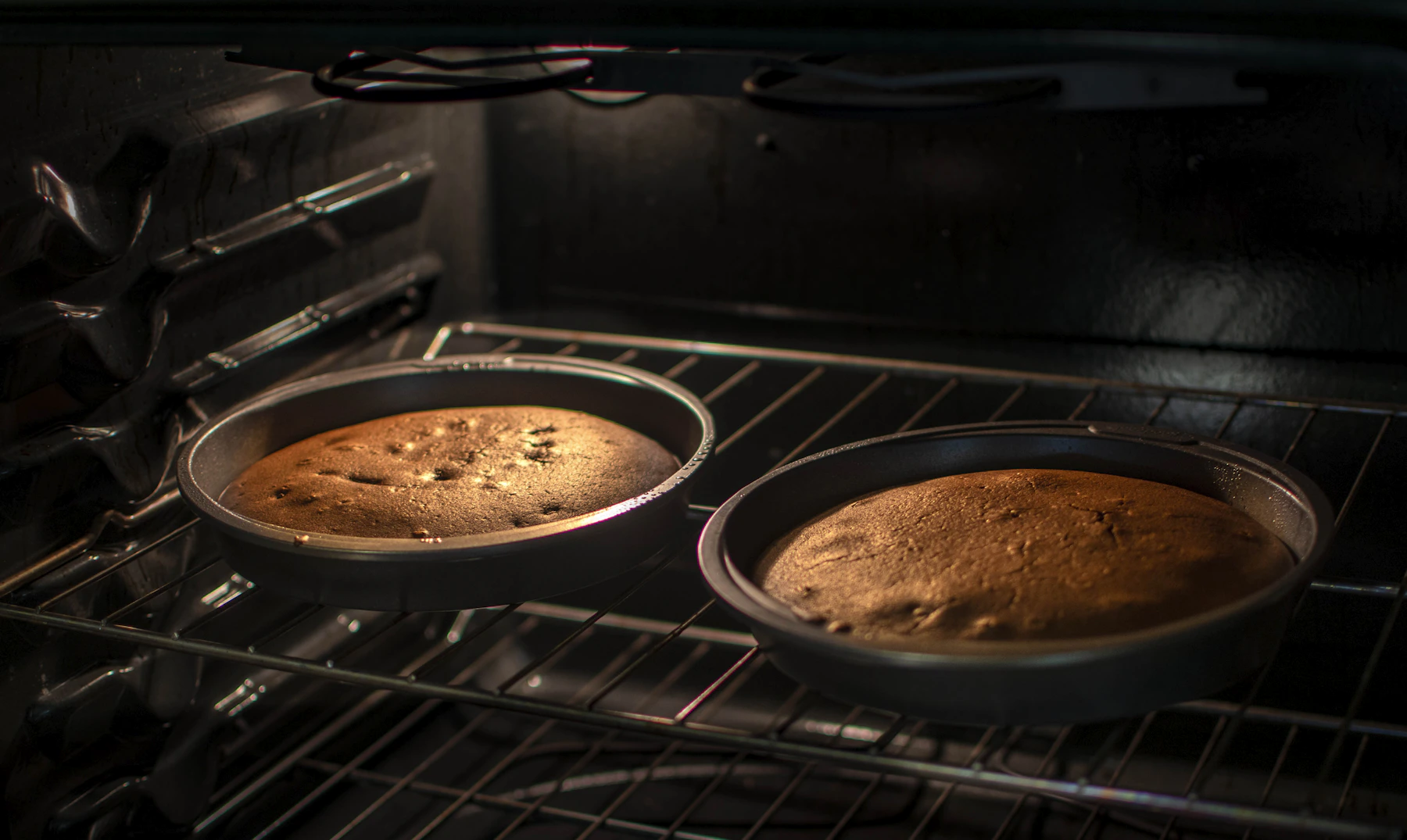 Fresh baked pastry presented in dark bakeware on a kitchen surface