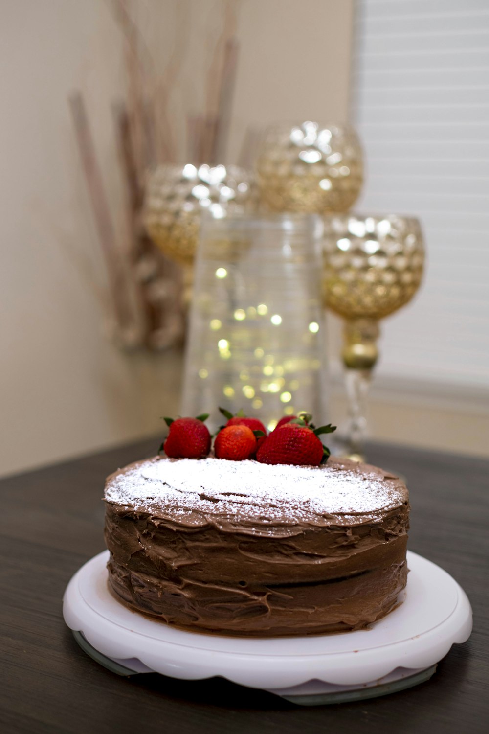 brown cake with strawberry on top