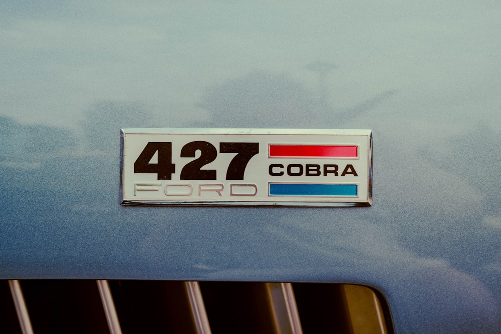 a sticker on the back of a car that says 427 cobra