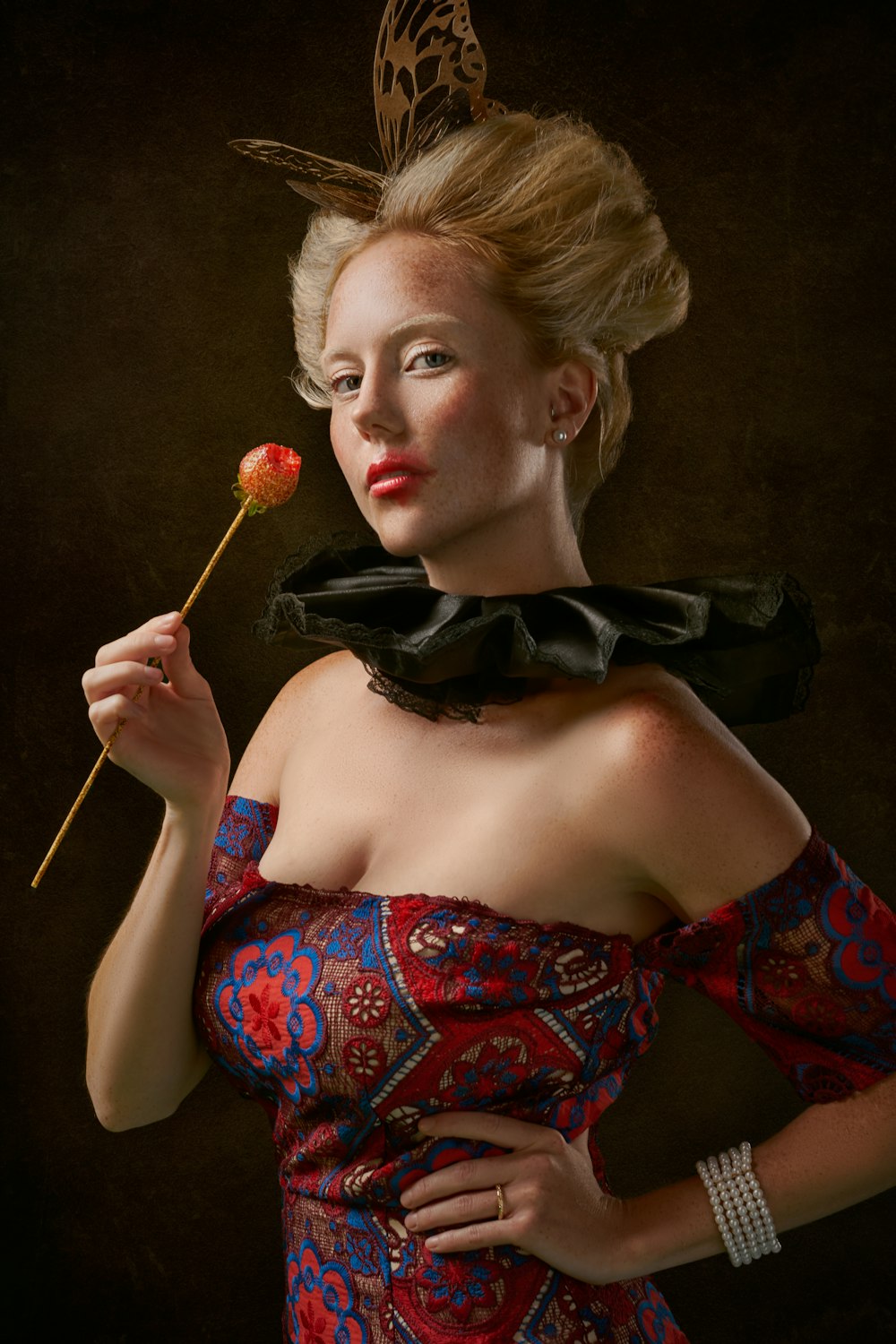 woman in red and blue floral tube dress