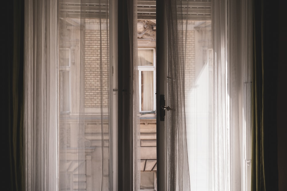 white wooden framed glass door