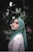 woman in green hijab standing near green plants